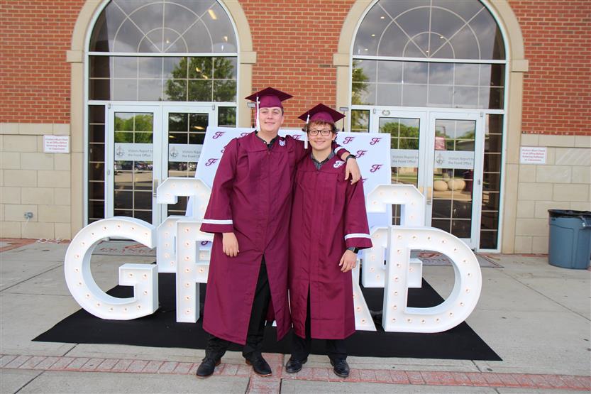 Graduates wearing maroon robes